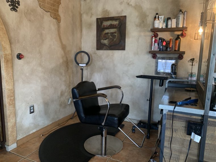 Styling station with exposed brick and Edison lighting
