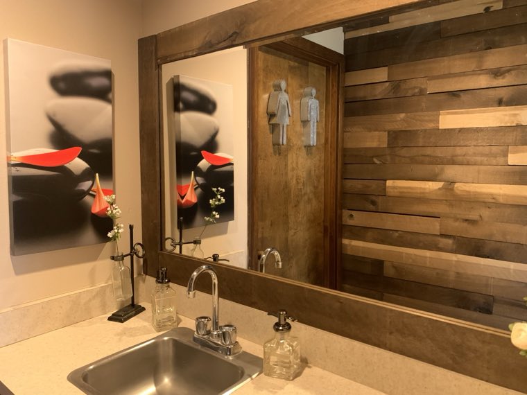 Reclaimed-wood wall behind the wash basin